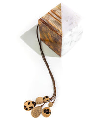 Necklace with faux fur pendants on a white surface