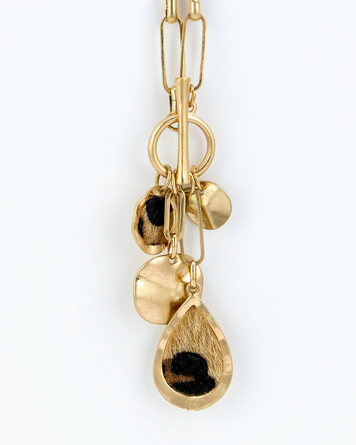 Gold necklace with teardrop-shaped pendants on a white background