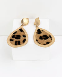 Gold teardrop earrings with leopard faux fur print on a white background