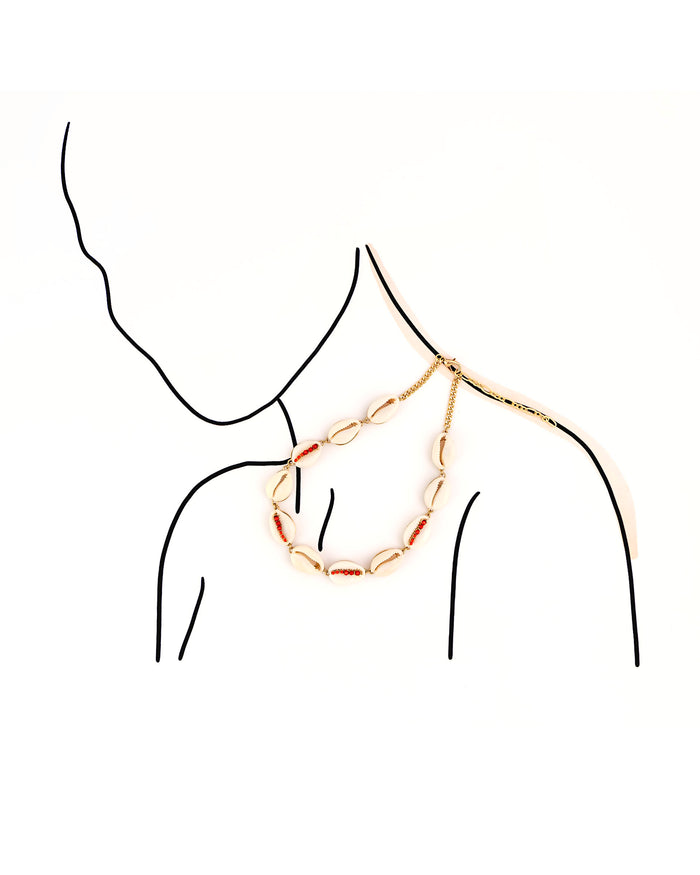 Gold chain necklace on a mannequin with a white background