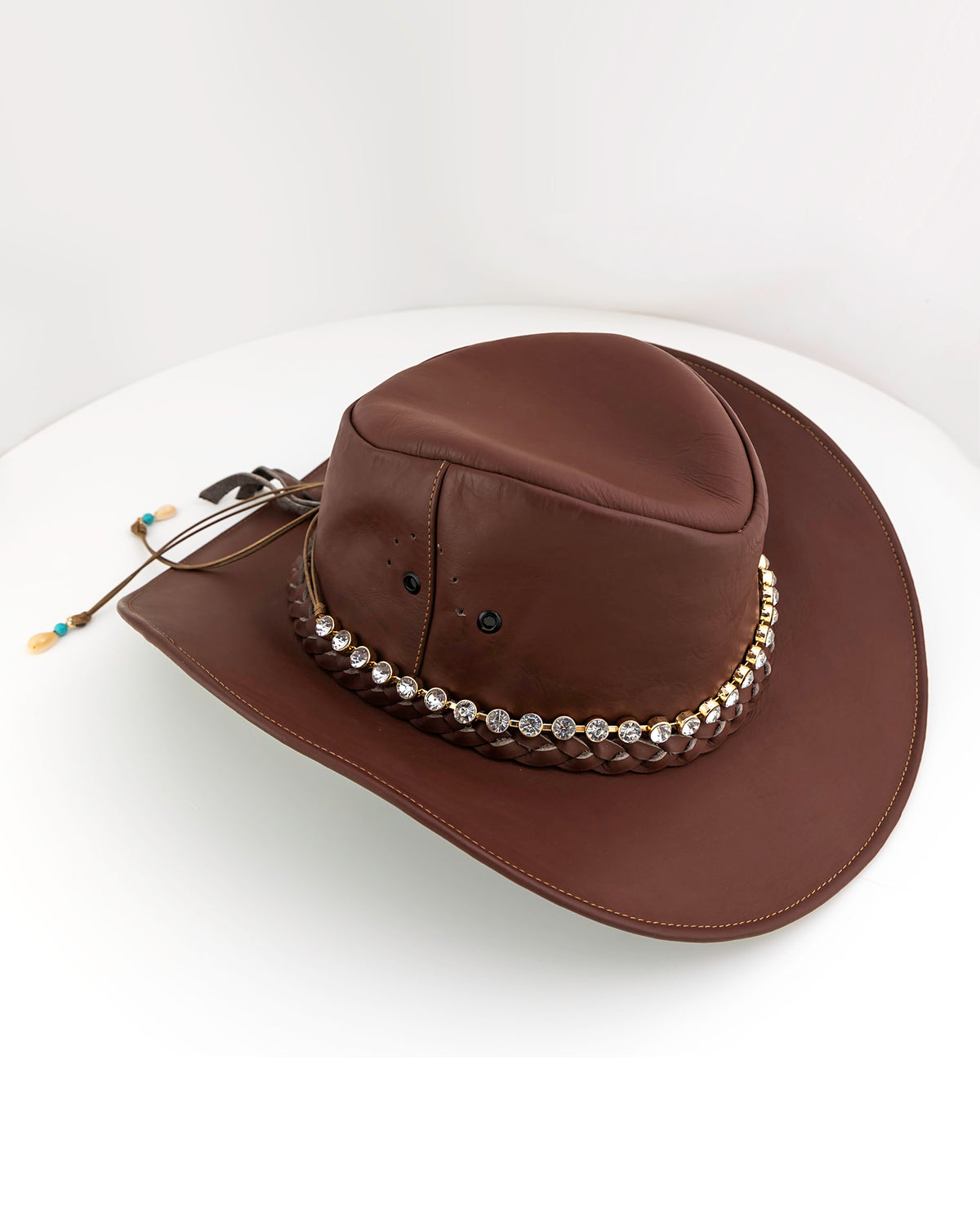 Decorative long necklace decorative on a brown cowboy hat. Another fun way to wear this jewelry piece!