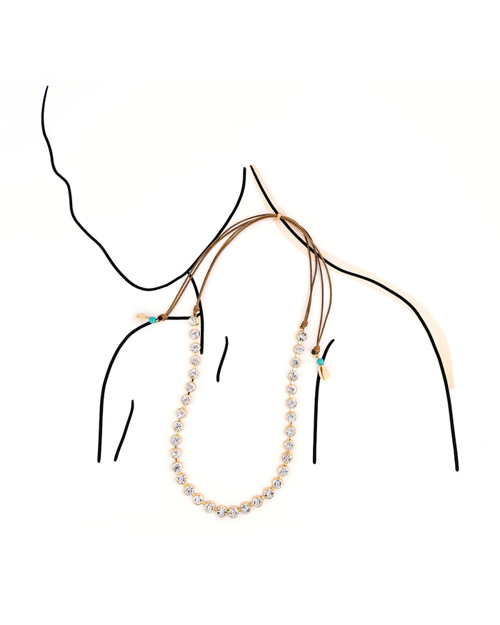 Long necklace on a mannequin with a white background