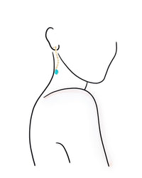 Earring with a blue gemstone on a white background