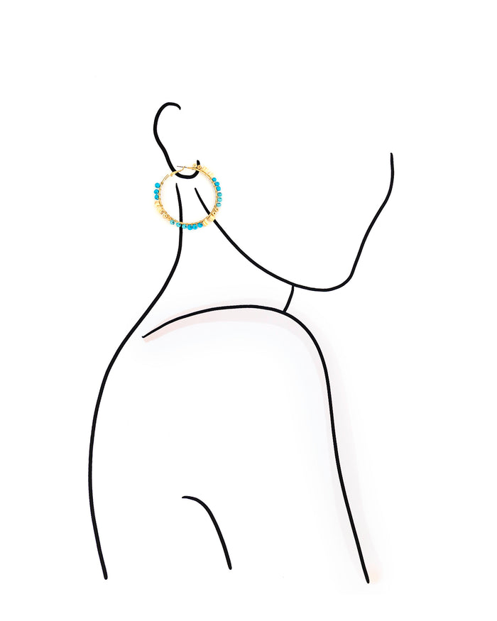 Outline of a person wearing earrings on a white background