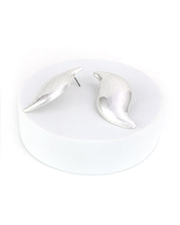 Pair of silver drop S-shaped earrings on a white background
