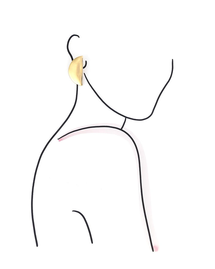 Gold earring on a white background