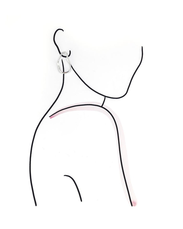 Model outline wearing silver hoop earrings