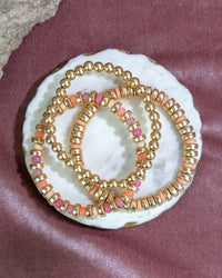 Gold Beaded Bracelet Set with Coral Accents