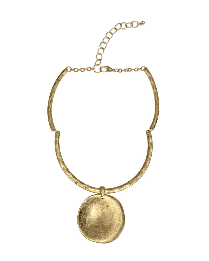 Gold necklace with a round pendant on a white background
