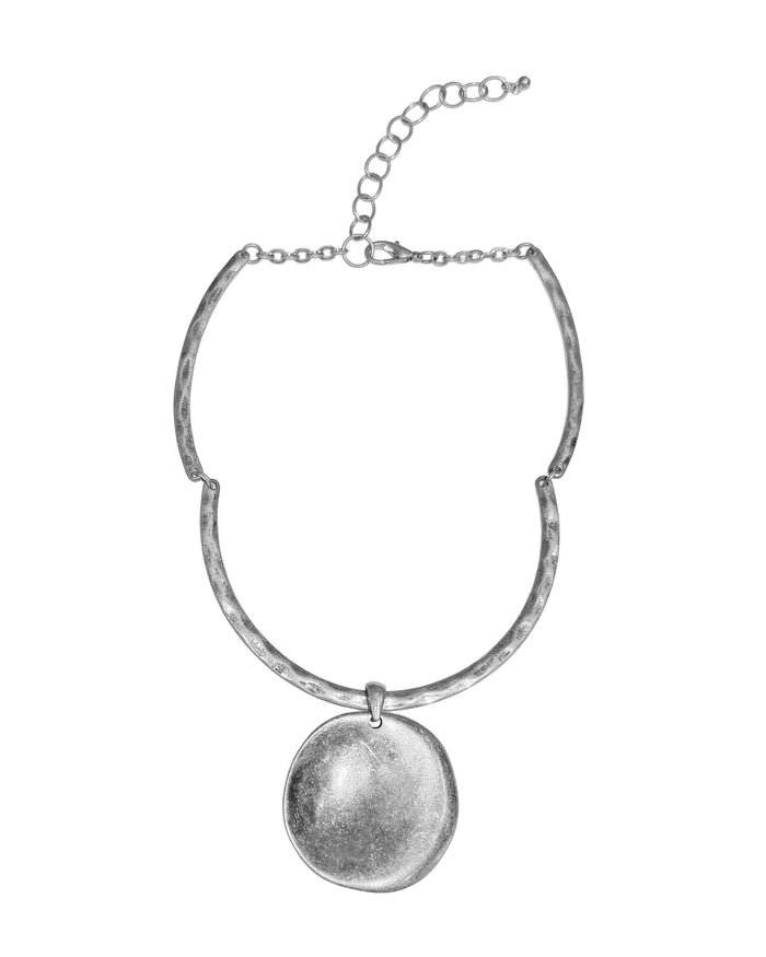 Silver necklace with a round pendant on a white background