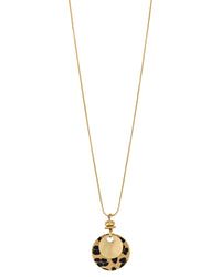 Long worn-gold necklace with layered gold-tone and leopard-print faux calf-hair fabric disc pendant on a white background.