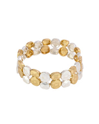 Two-row stretch bracelet with irregular hammered worn-gold- and worn-silver-tone discs on a white background.