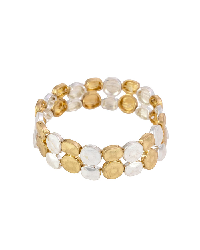 Two-row stretch bracelet with irregular hammered worn-gold- and worn-silver-tone discs on a white background.