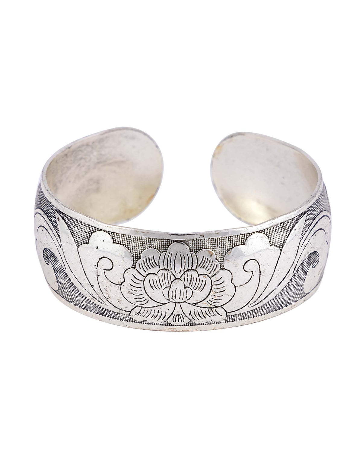 Antique-silver-tone wide open cuff bracelet with an etched floral motif on a white background.