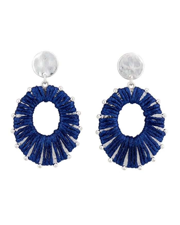 Worn-silver oval post drop earrings with deep-blue wrapped accents and an open center on a white background.