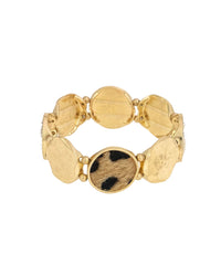 Worn-gold stretch bracelet with irregular hammered discs and leopard-print faux calf-hair fabric accents on a white background.
