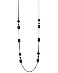 Black beaded necklace on a white background