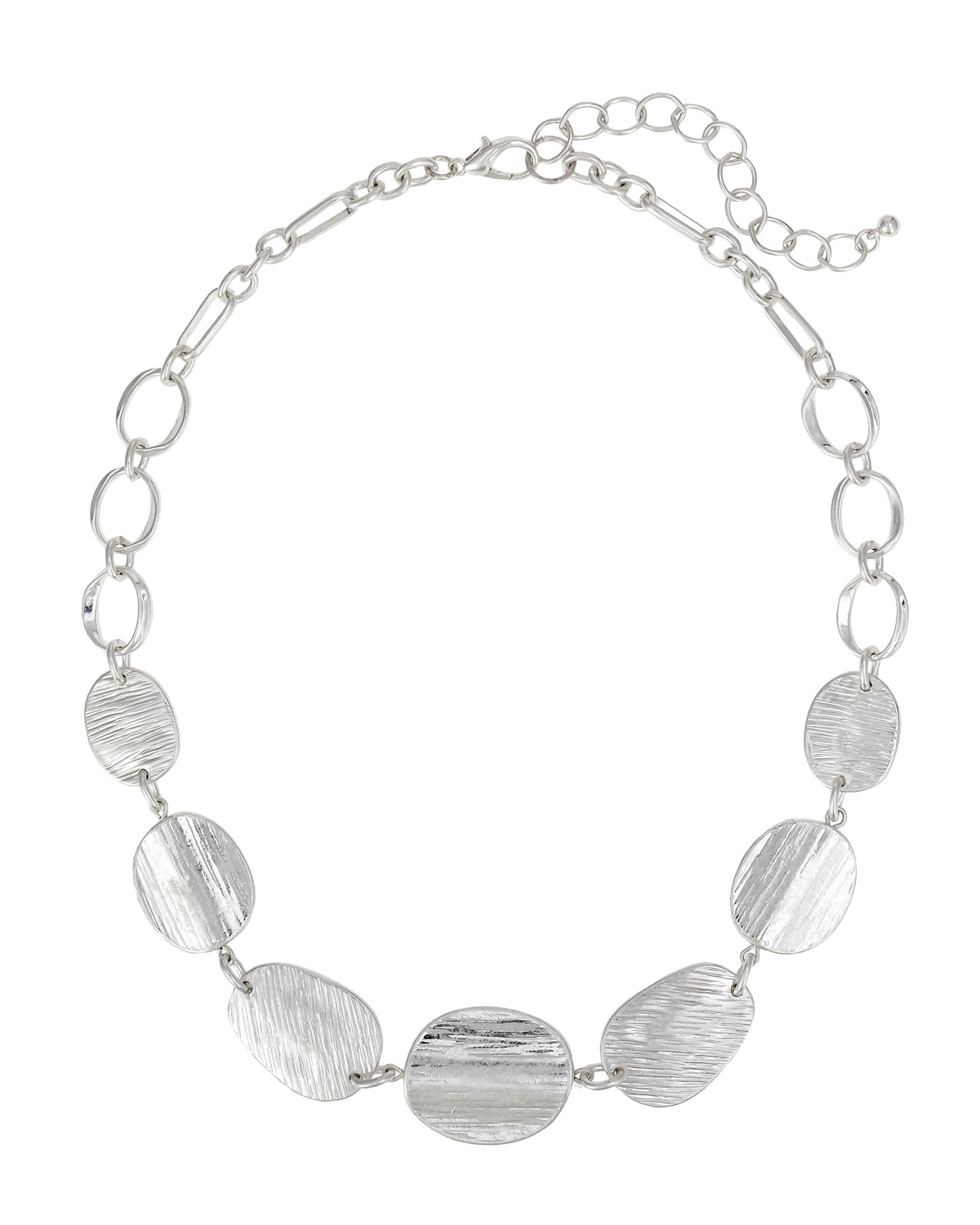 Worn-silver necklace with open links and textured organic discs, lobster clasp, and extender on a white background.