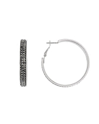 Silver hoop earrings with embedded stones on a white background