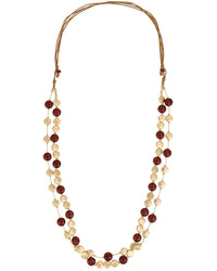 Necklace with red and beige beads on a white background