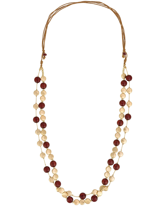 Necklace with red and beige beads on a white background
