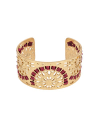Gold bracelet with red wrapping on a white background