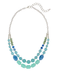 Necklace with blue and green beads on a white background