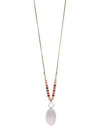 Necklace with beads and a large white pendant on a white background
