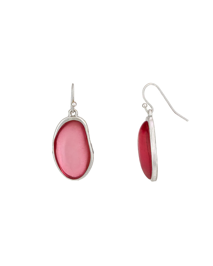Pair of earrings with pink oval stones on a white background