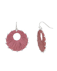 Pink raffia earrings with pearl-like beads on a white background