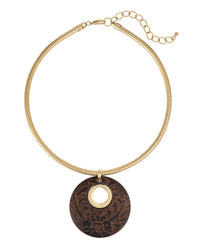 Gold necklace with a dark brown circular pendant on a white background