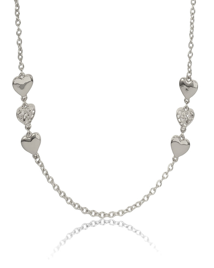 Silver necklace with heart-shaped pendants on a white background