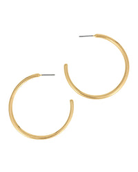 A pair of gold-plated open hoop earrings with a textured, slightly tapered finish and flat backings, shown on a solid white background.