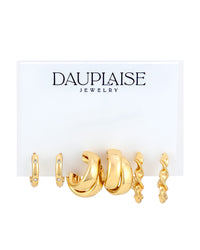 A set of three gold-toned huggie hoop earrings from Dauplaise Jewelry, displayed on a white branded card against a white background.