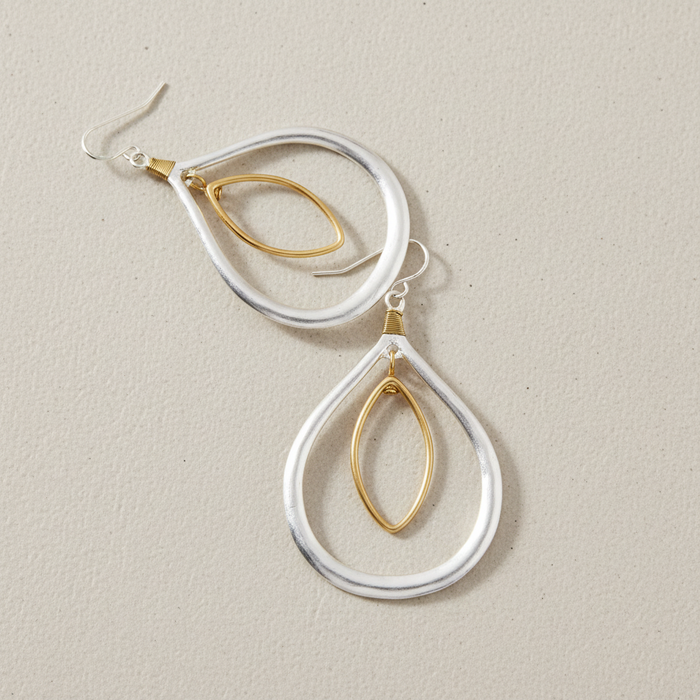 Two-Tone Orbital Teardrop Earrings lifestyle shot – artistic arrangement